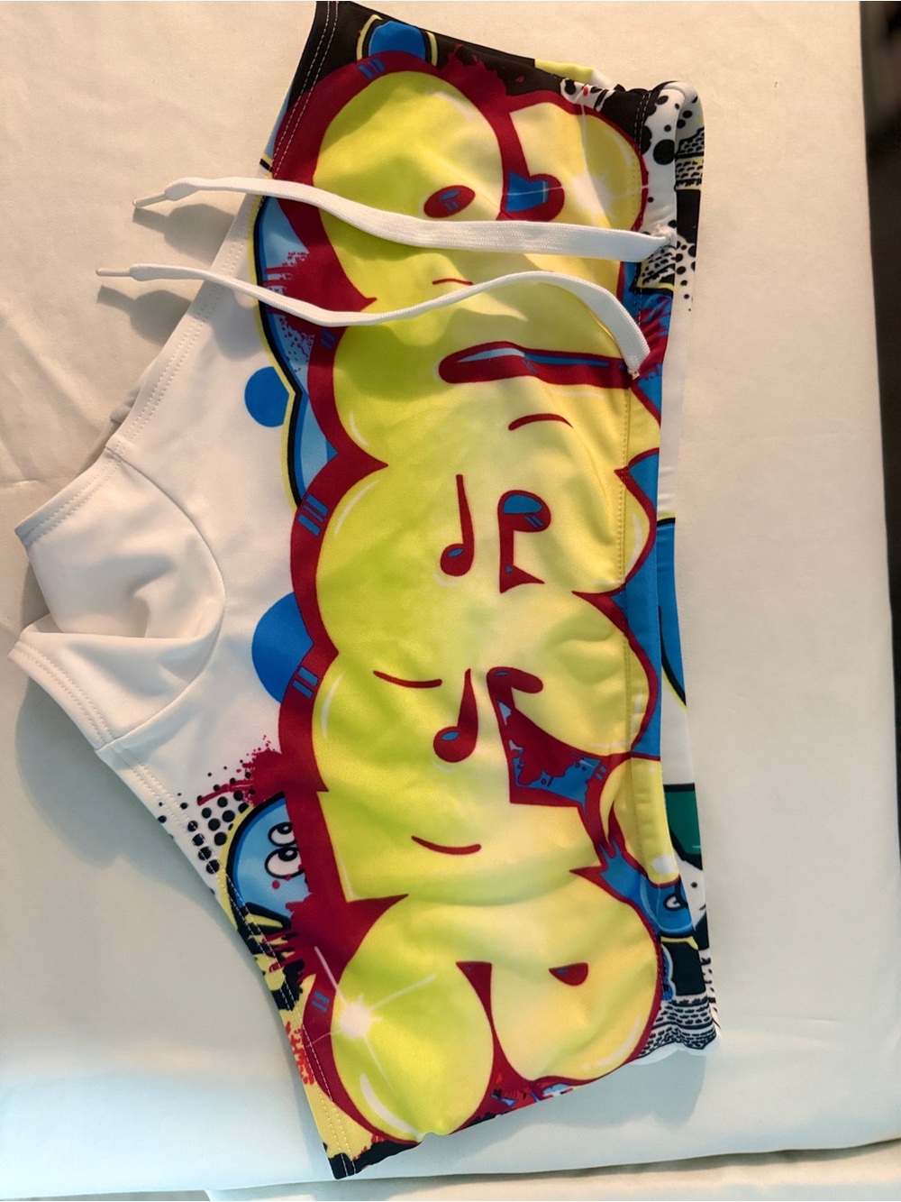 Men's White Swim Trunks with Yellow Graffiti Print